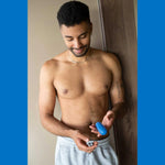Arcwave Ghost Soft Silicone Stroker, Blue, Stroker in Man's Left hand