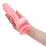 Pure Love Glow-In-The-Dark 7.5-Inch Silicone Dildo, Pink, Dildo in Hand