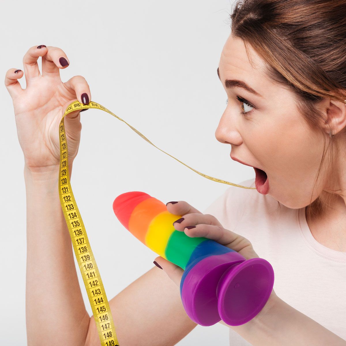 Pure Love Pride 8-Inch Silicone Dildo, Woman Holding Dildo and Measuring Tape